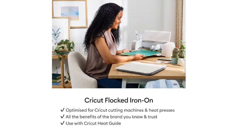 A person using a Cricut machine at a home workspace A person using a Cricut machine at a home workspace
