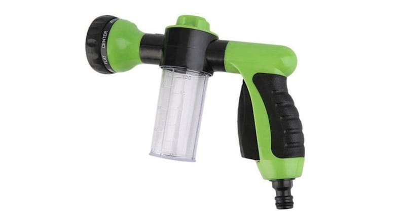 Green and black garden hose nozzle with a clear soap dispenser attachment Green and black garden hose nozzle with a clear soap dispenser attachment