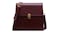 A maroon leather crossbody bag with a gold buckle and an adjustable strap A maroon leather crossbody bag with a gold buckle and an adjustable strap