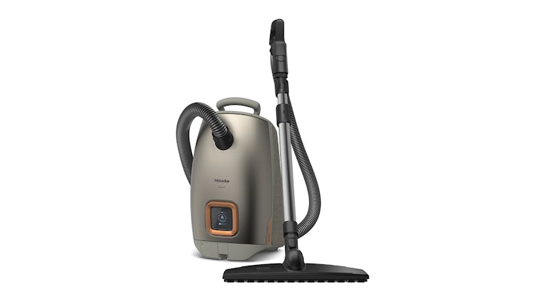 Titanium Pearl Finish Miele Guard L1 Comfort XL Vacuum Cleaner standing upright with flexible hose and floor nozzle Titanium Pearl Finish Miele Guard L1 Comfort XL Vacuum Cleaner standing upright with flexible hose and floor nozzle
