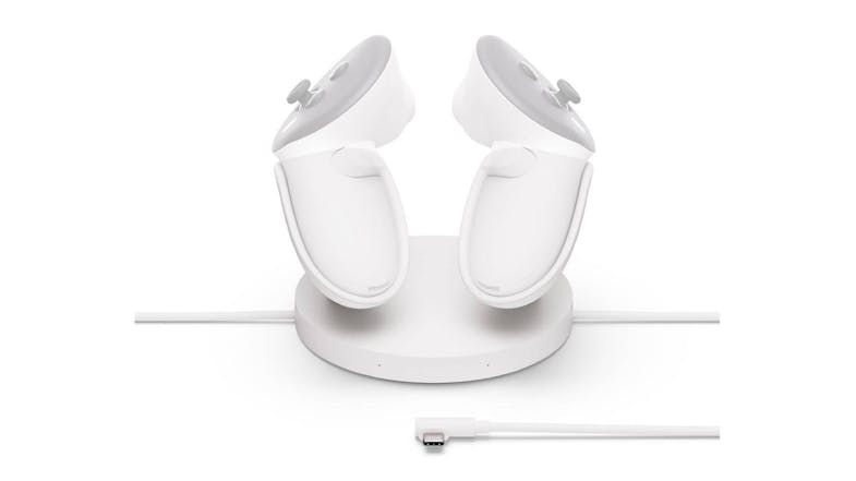 Two white VR controllers on a round charging dock with a USB-C cable placed in front Two white VR controllers on a round charging dock with a USB-C cable placed in front