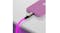 Pink-glowing cable connected to a pink smartphone on a white surface Pink-glowing cable connected to a pink smartphone on a white surface