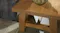 A close-up top view of the lamp table showcasing its beautiful pine timber finish A close-up top view of the lamp table showcasing its beautiful pine timber finish