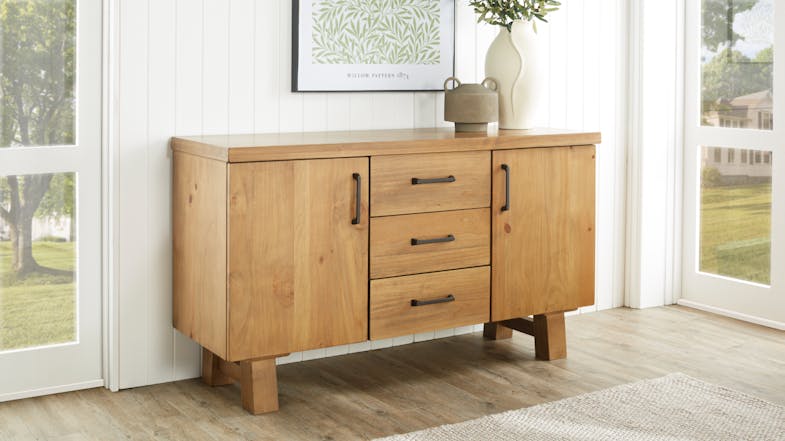 A view of a buffet table in a light and inviting dining room setup A view of a buffet table in a light and inviting dining room setup