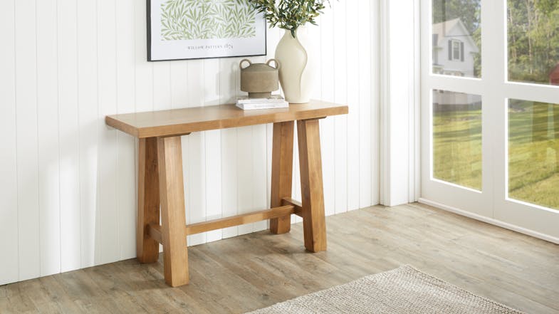 A wide view of the hall table, beautifully displayed in a light and inviting entryway A wide view of the hall table, beautifully displayed in a light and inviting entryway