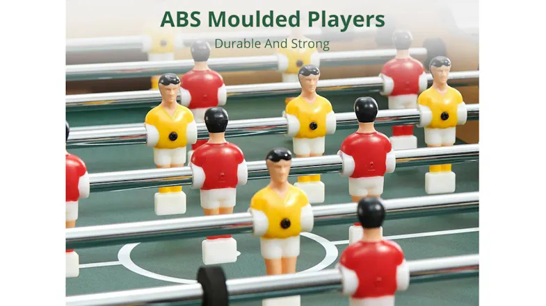 ABS moulded foosball players in red and yellow colours attached to metal rods on a green playfield ABS moulded foosball players in red and yellow colours attached to metal rods on a green playfield