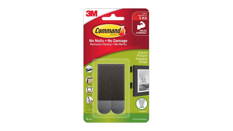 Packaging of 3M Command Medium Picture Hanging Strips showing four black sets Packaging of 3M Command Medium Picture Hanging Strips showing four black sets