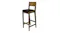 Slightly angled view of a wooden bar chair, highlighting its long and sturdy legs Slightly angled view of a wooden bar chair, highlighting its long and sturdy legs