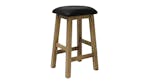 Slightly angled view of a wooden bar stool, showcasing its sturdy timber legs Slightly angled view of a wooden bar stool, showcasing its sturdy timber legs