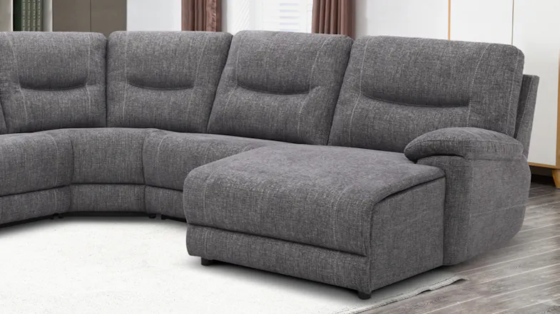 Close-up of the right side of a grey sectional sofa showing plush cushions, armrest, and chaise Close-up of the right side of a grey sectional sofa showing plush cushions, armrest, and chaise