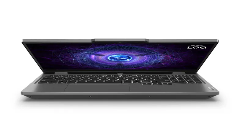 Low-angle front view of partially opened gaming laptop showing keyboard and digital graphics on screen Low-angle front view of partially opened gaming laptop showing keyboard and digital graphics on screen