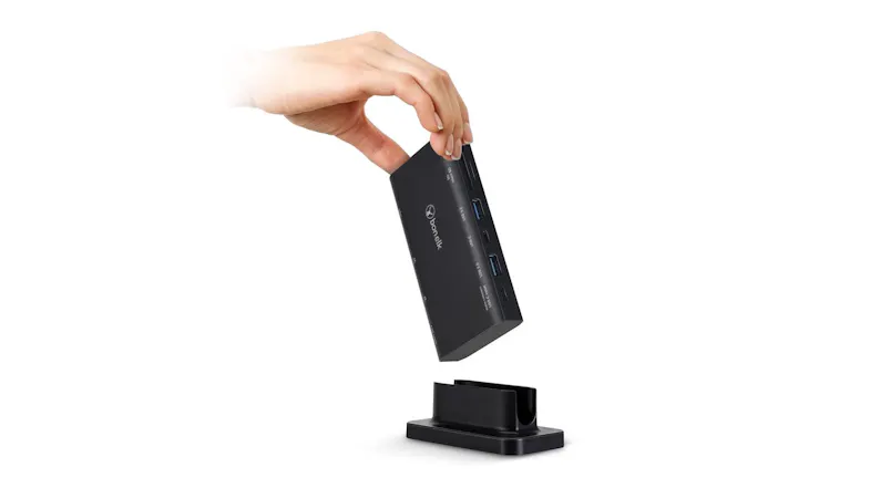 A hand placing the Bon.Elk Multiport Desktop Hub onto its base, showing its detachable design A hand placing the Bon.Elk Multiport Desktop Hub onto its base, showing its detachable design