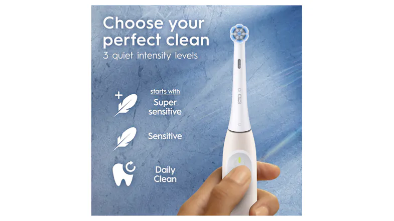 A hand pressing a brush button with a feather and tooth icons A hand pressing a brush button with a feather and tooth icons