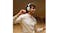 A person dancing while listening to music on white headphones A person dancing while listening to music on white headphones