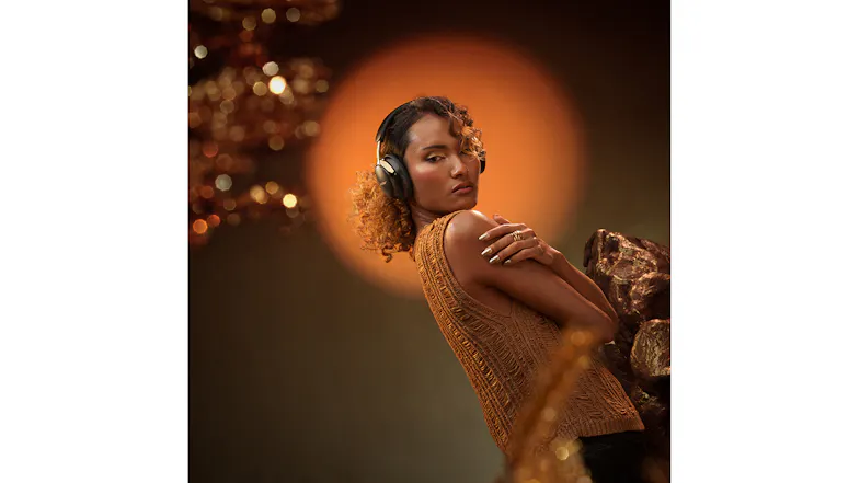 A person making a pose wearing Bose wireless headphones A person making a pose wearing Bose wireless headphones