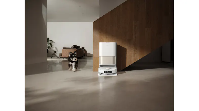 Robot vacuum dock at home, next to a dog, highlighting its pet-friendly features Robot vacuum dock at home, next to a dog, highlighting its pet-friendly features