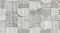Detailed view of grey rectangular rug with overlapping blocky shapes and linear texture. Detailed view of grey rectangular rug with overlapping blocky shapes and linear texture.