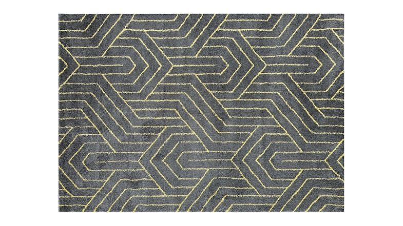 Grey rectangular rug with yellow geometric pattern. Grey rectangular rug with yellow geometric pattern.