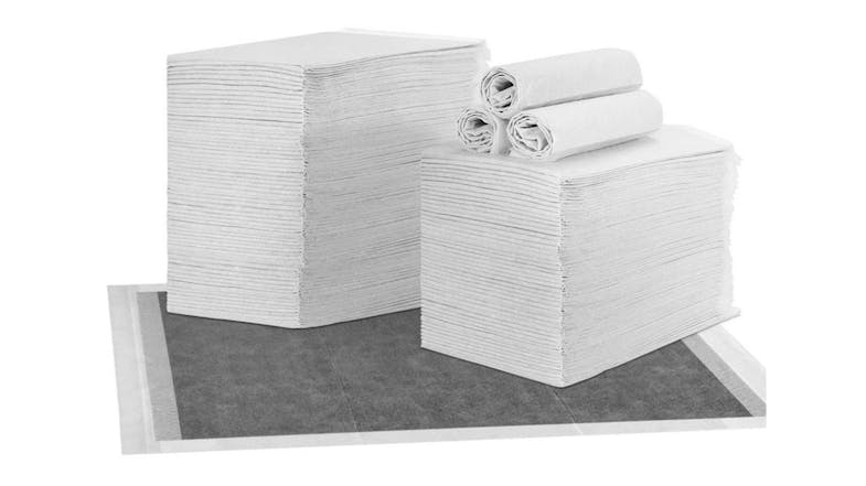 A multiple stacks and rolls of gray a pet training pad A multiple stacks and rolls of gray a pet training pad