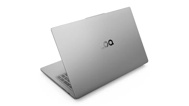Left-side rear view of the partially open Lenovo 15.6" laptop showing keyboard and ports Left-side rear view of the partially open Lenovo 15.6" laptop showing keyboard and ports