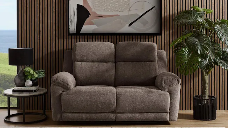 Brown Eathon Fabric 2 Seater Electric Recliner Sofa in a stylish living room with wooden panel walls Brown Eathon Fabric 2 Seater Electric Recliner Sofa in a stylish living room with wooden panel walls