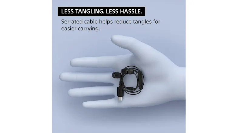 A gloved hand holding coiled USB-C earphones A gloved hand holding coiled USB-C earphones