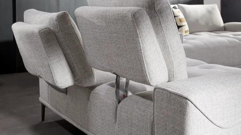 A close up view of the sofa's back elevated to showcase its adjustable back mechanism A close up view of the sofa's back elevated to showcase its adjustable back mechanism