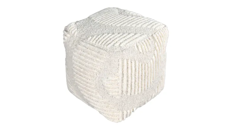 White fabric pouf with raised geometric patterns and a textured surface White fabric pouf with raised geometric patterns and a textured surface