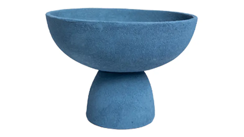 Blue textured pedestal bowl with a wide, shallow top and rounded base in a modern design Blue textured pedestal bowl with a wide, shallow top and rounded base in a modern design
