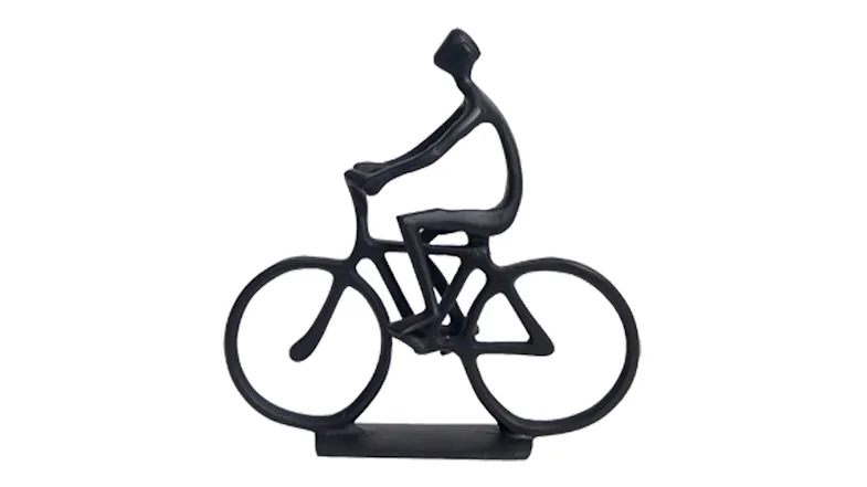 Minimalist metal sculpture of a person riding a bicycle, made from thin rods Minimalist metal sculpture of a person riding a bicycle, made from thin rods