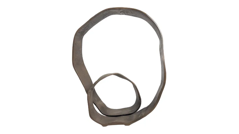 Abstract metal sculpture of intertwined loops forming an irregular circular shape Abstract metal sculpture of intertwined loops forming an irregular circular shape