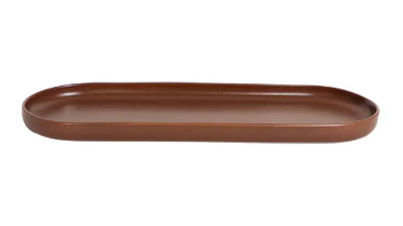 Brown ceramic tray with an elongated oval shape and smooth, minimalist design Brown ceramic tray with an elongated oval shape and smooth, minimalist design