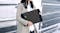 A woman carrying the Kin Laptop Sleeve with two hands A woman carrying the Kin Laptop Sleeve with two hands