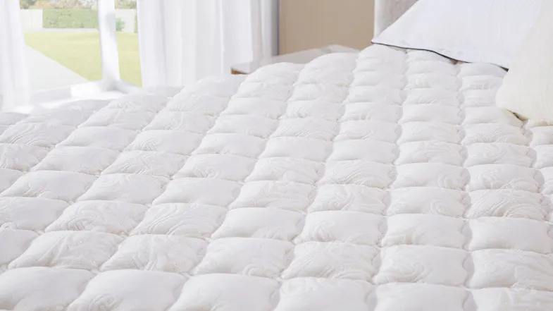 Couture Firm Queen Mattress, close up of mattress top layer. Couture Firm Queen Mattress, close up of mattress top layer.