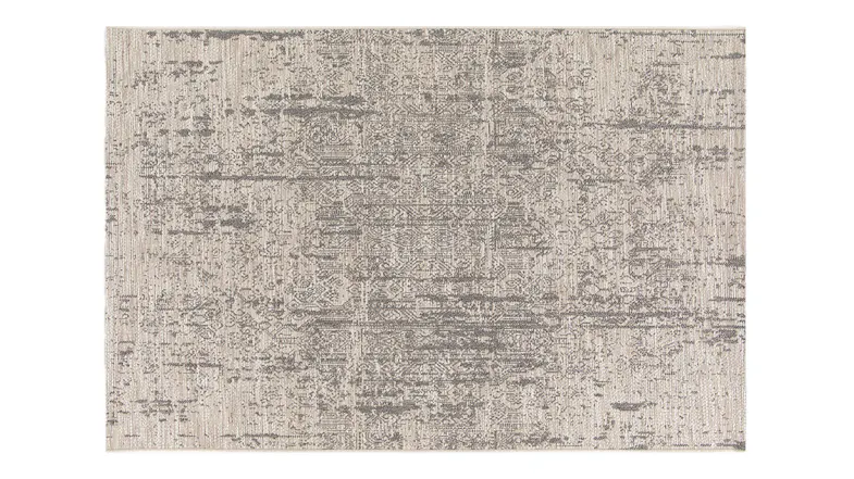 Full view of the Camilo Rug in beige, featuring a subtle texture Full view of the Camilo Rug in beige, featuring a subtle texture