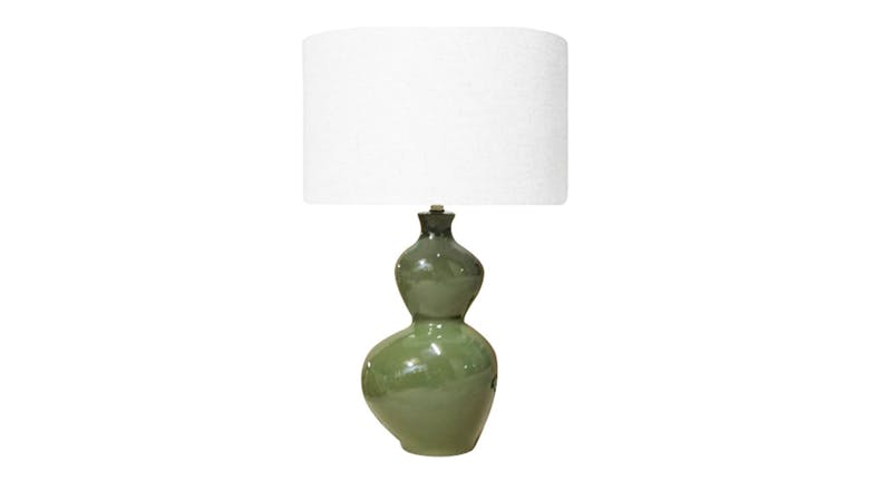 Ceramic table lamp with a double-gourd or hourglass-shaped base in olive glaze, topped with a plain white drum shade Ceramic table lamp with a double-gourd or hourglass-shaped base in olive glaze, topped with a plain white drum shade