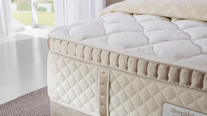 Couture Mattress by Sleepmaker Luxury, close up of mattress end with diamantes feature. Couture Mattress by Sleepmaker Luxury, close up of mattress end with diamantes feature.