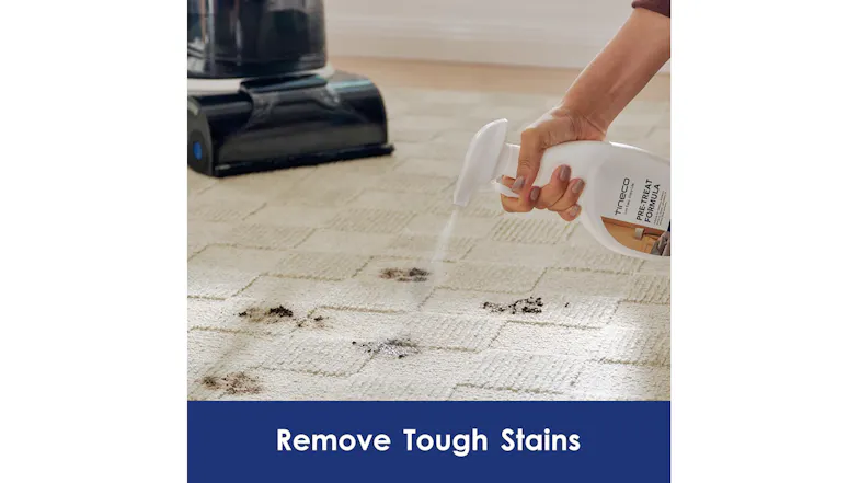 Hand-spraying Tineco formula on a stained carpet to demonstrate stain removal Hand-spraying Tineco formula on a stained carpet to demonstrate stain removal