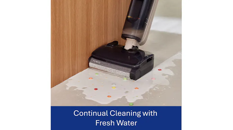 Vacuum cleaning a spill near a wall with text "Continual Cleaning with Fresh Water." Vacuum cleaning a spill near a wall with text "Continual Cleaning with Fresh Water."