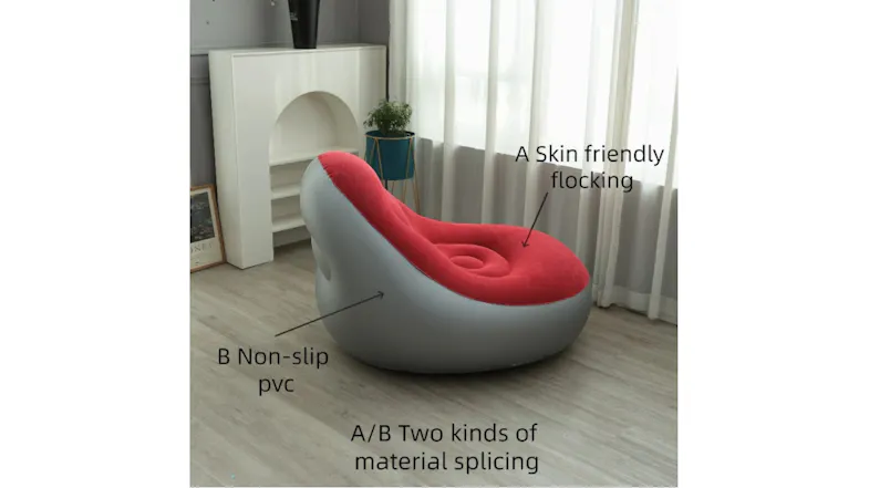 Inflatable chair with red flocked seat and grey non-slip PVC base, shown in a modern living room Inflatable chair with red flocked seat and grey non-slip PVC base, shown in a modern living room