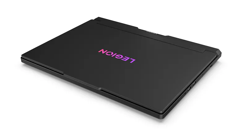 Corner view of a closed laptop with a purple Legion logo on the lid Corner view of a closed laptop with a purple Legion logo on the lid