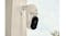 An Arlo security camera mounted on the wall outdoors An Arlo security camera mounted on the wall outdoors