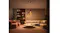 Modern living room with Philips Hue pendant lights creating warm ambiance Modern living room with Philips Hue pendant lights creating warm ambiance