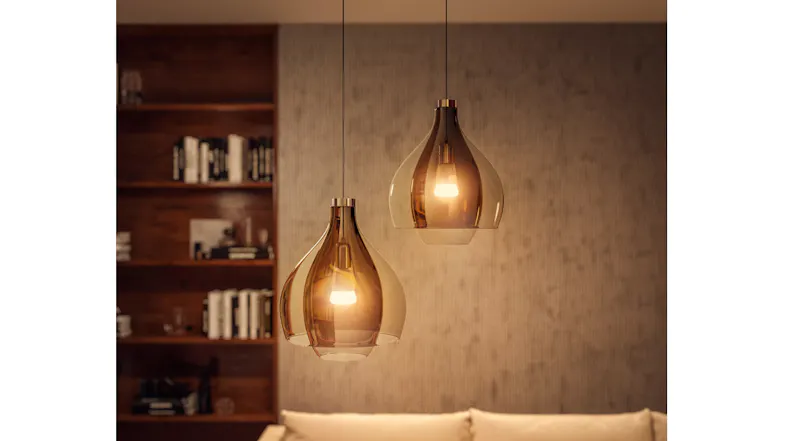 Amber glass pendant lights with Philips Hue bulbs in cozy setting Amber glass pendant lights with Philips Hue bulbs in cozy setting