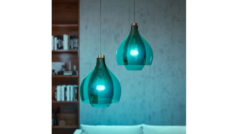Teal glass pendant lights with Philips Hue bulbs in modern living room Teal glass pendant lights with Philips Hue bulbs in modern living room