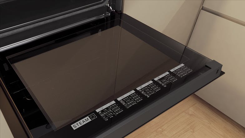 Close-up view of the Whirlpool oven with an open glass door Close-up view of the Whirlpool oven with an open glass door