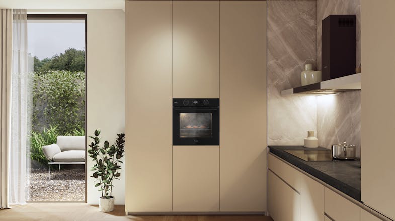 A modern kitchen with a wall-mounted oven near the stone counter A modern kitchen with a wall-mounted oven near the stone counter