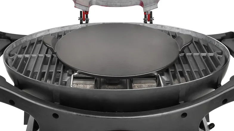 A view of the pizza stone placed on top of a compatible BBQ unit A view of the pizza stone placed on top of a compatible BBQ unit