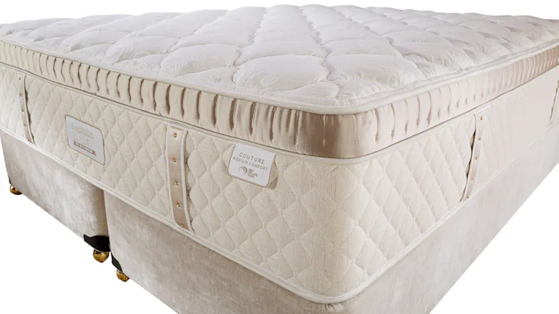 Couture Mattress by Sleepmaker Luxury, close up from corner of mattress showing padded top layer, and diamante bands. Couture Mattress by Sleepmaker Luxury, close up from corner of mattress showing padded top layer, and diamante bands.