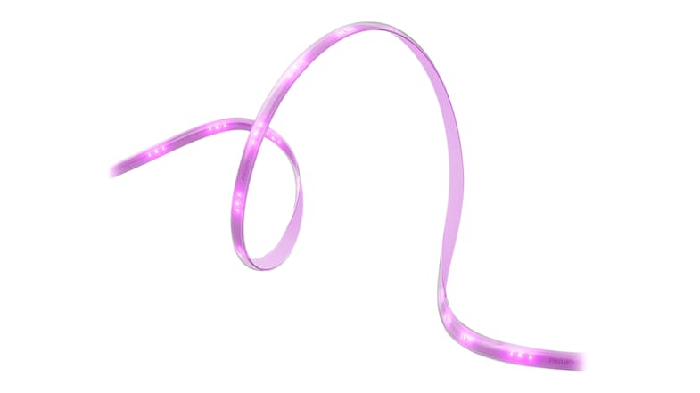 Curved Philips Hue light strip glowing in pink, showing flexible design and evenly spaced LEDs along the strip Curved Philips Hue light strip glowing in pink, showing flexible design and evenly spaced LEDs along the strip